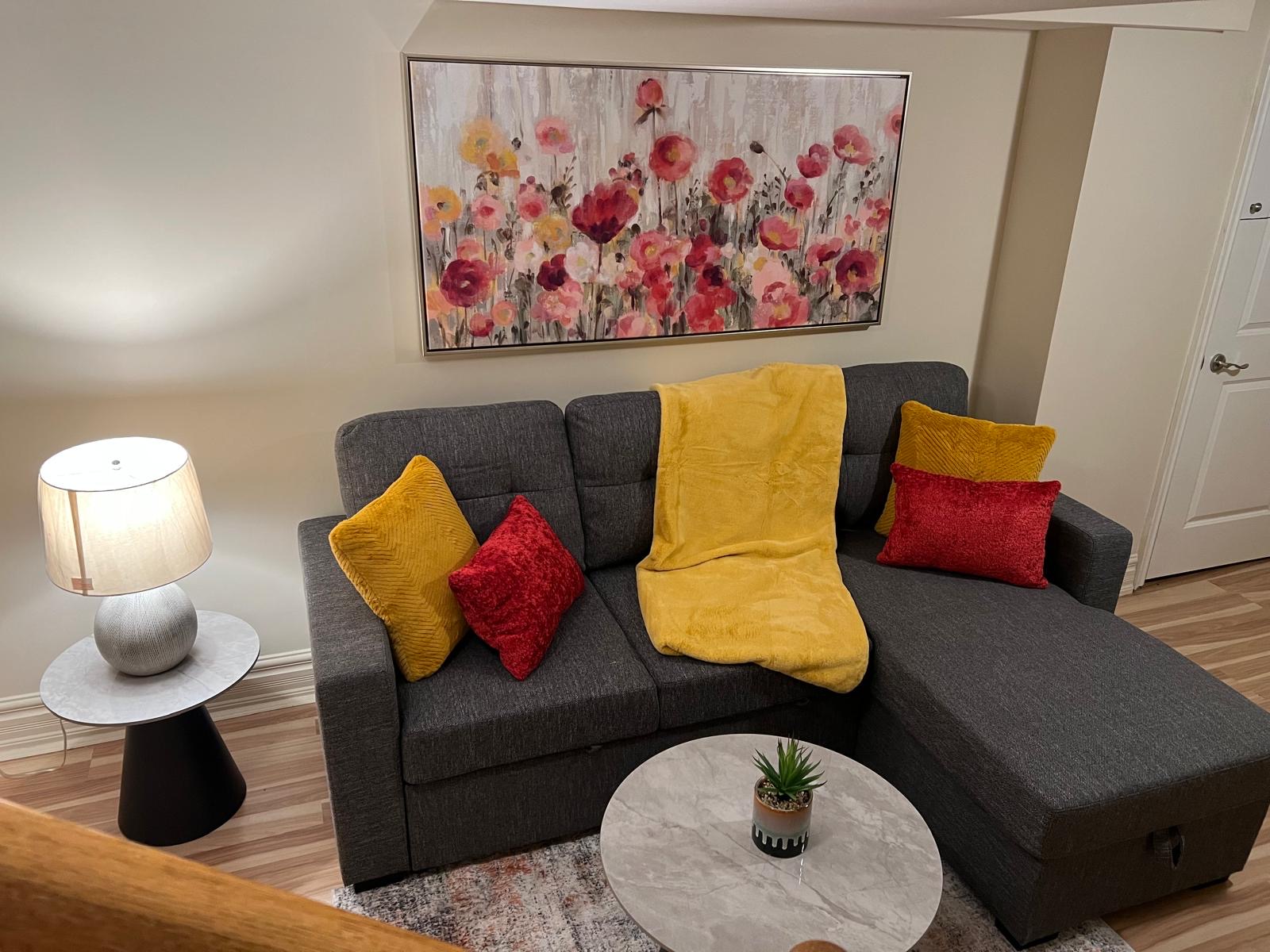 Guest-ready rental suite living room with sectional sofa